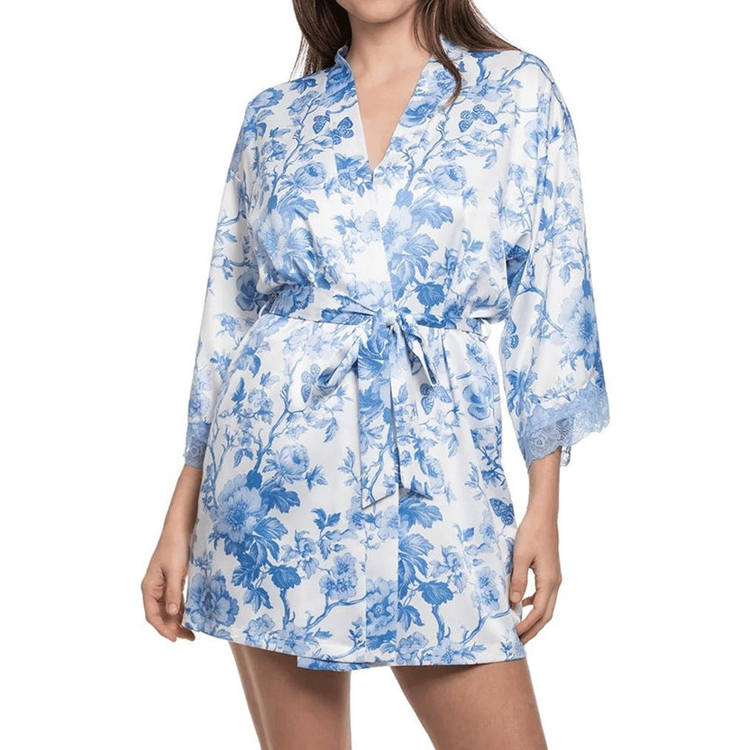 Woman wearing a blue floral dress on a white background