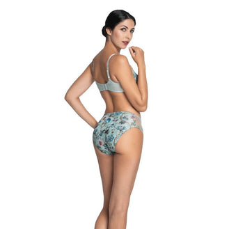 Woman wearing a floral underwear set on a white background