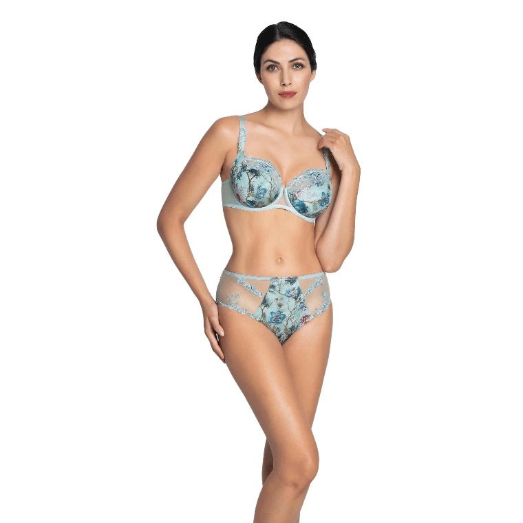 Woman wearing a floral lingerie set on a white background