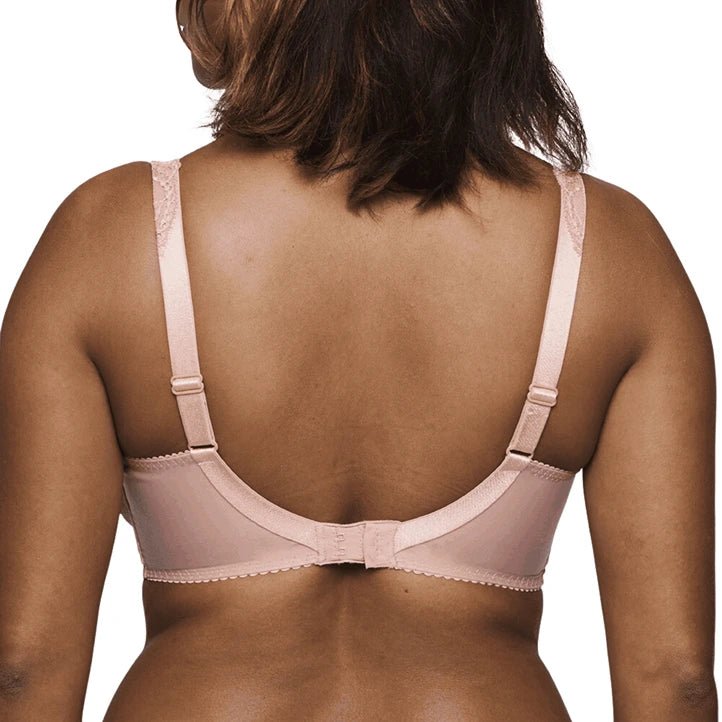 Rear view of a woman wearing a light pink open-back bra with adjustable straps and scalloped trim, shown against a plain white background.