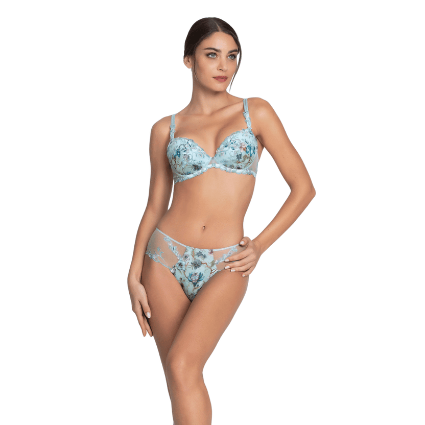 Woman wearing a floral lingerie set on a white background