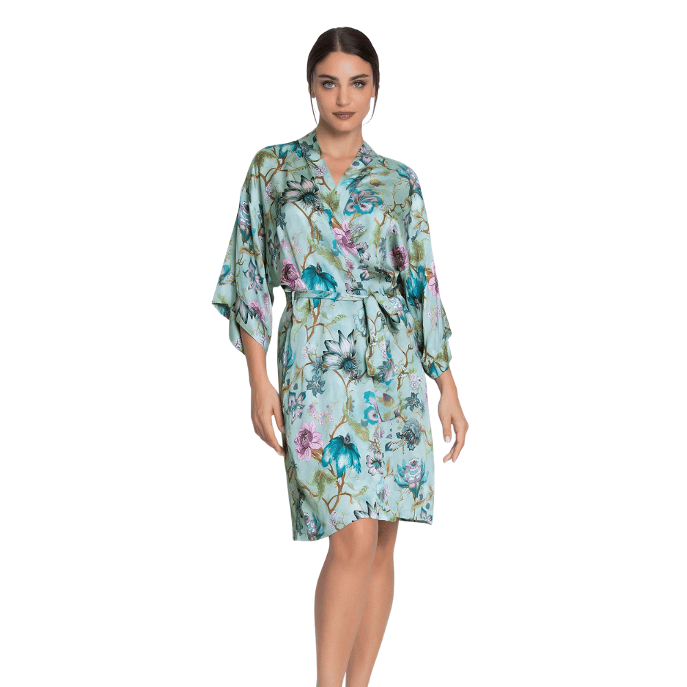 Woman wearing a floral Dressing Gown on a white background