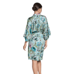 Woman wearing a floral Dressing Gown  on a white background Back
