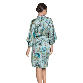 Woman wearing a floral Dressing Gown  on a white background Back